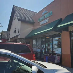 a car parked in front of the store