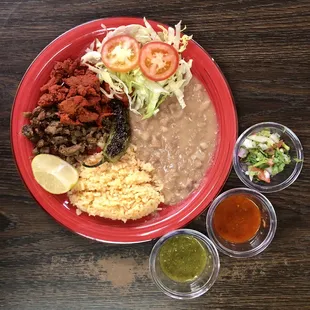 Pastor and fajita mix plate with rice, beans, side salad and tortillas 8.99+tax