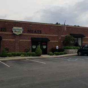 a car parked in front of a restaurant