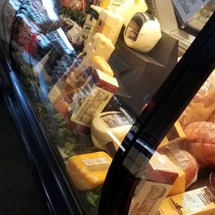 a variety of meats in a display case