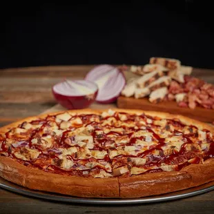 two pizzas on a wooden table