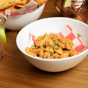 two bowls of food and a drink