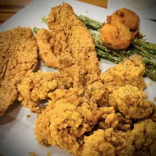 1/2 and 1/2 Catfish and oysters with side and hush puppies. Yum! Spicy and Crunchy