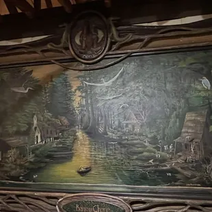 a painting of a river scene