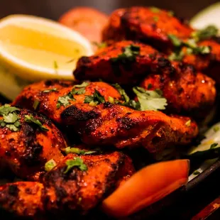 Tandoori Chicken: Char-grilled perfection with a fiery twist!