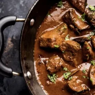 Indulge in the rich and aromatic flavors of Rogan Josh, a classic Kashmiri dish that's a true culinary masterpiece.