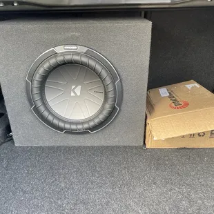 This place is an authorized Kicker Dealer. (my old enclosure with a brand spanking new Kicker Comp Q subwoofer)