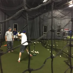 Hitting instructor giving hitting lessons at Premier Baseball Kansas City Baseball Facility