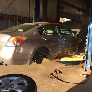 All four wheels removed to check a missing lug nut on rear drivers side.