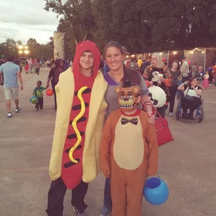 Fall festival.mommy and her two sons.looks like a perfect match