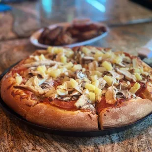 a pizza with pineapple toppings
