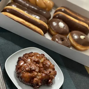 Apple Fritter and Assorted Dozen donuts box.
