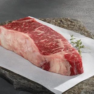 a piece of beef on a piece of paper