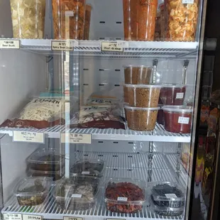 Assorted Korean soups and banchan in the fridge
