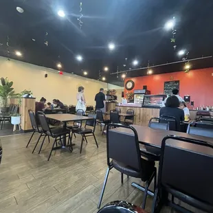 a restaurant with tables and chairs