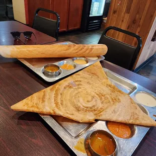 a pancake and a side of dipping sauces