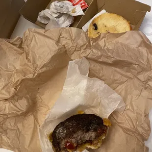 a hamburger and a donut in a box