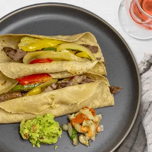 a plate of food and a glass of wine