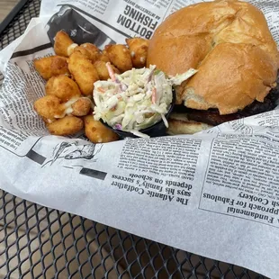 Barbecue sandwich with cheese curds and coleslaw.