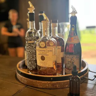 bottles of alcohol on a barrel