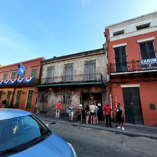 a group of people standing in front of a building