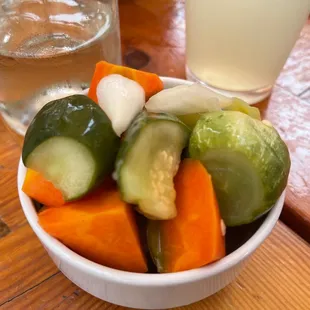 a bowl of vegetables and a glass of water