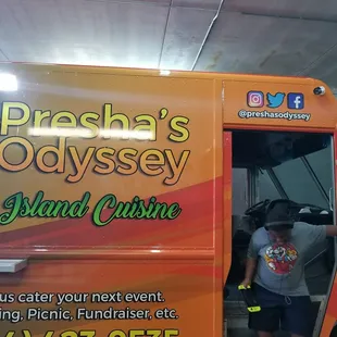 a man opening the door of a food truck