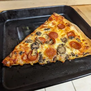 Pepperoni and mushroom slice, reheated