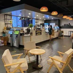 a coffee shop with tables and chairs