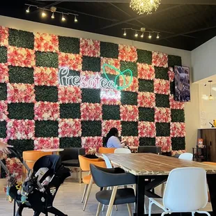 a dining area with tables and chairs