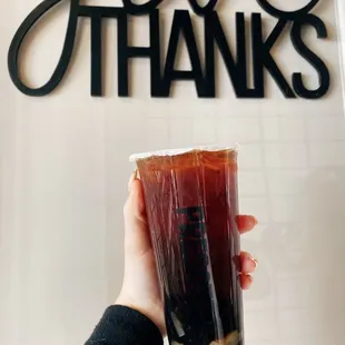 a person holding a cup of coffee