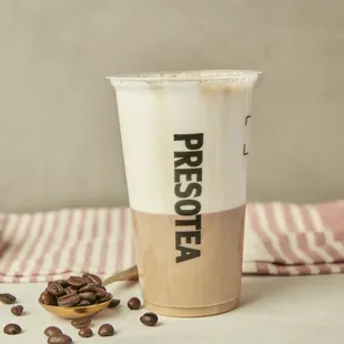 a cup of coffee and coffee beans