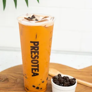 a cold drink and a bowl of beans