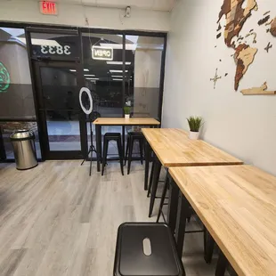 tables and stools in a coffee shop