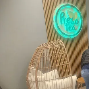 a woman sitting on a chair in a living room