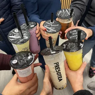 a group of people holding drinks