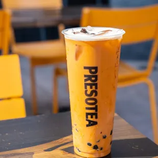 a cup of iced coffee on a table