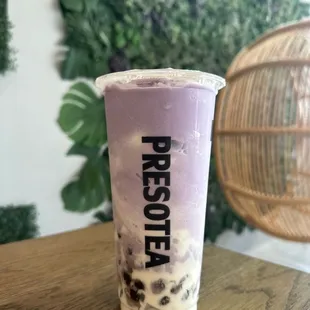 a cup of blueberry milkshake