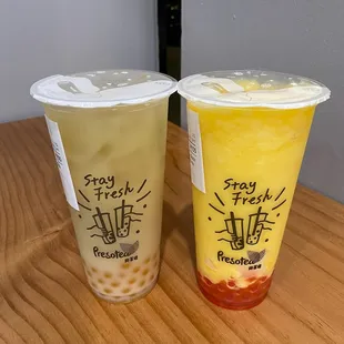 White Peach Milk Tea with Peach Boba, 30% sugar (left); Mango Pineapple Slush w/Strawberry Popping Boba (right)