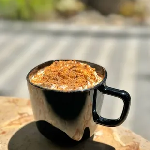 S'MORE BISCOFF - Marshmallow-flavored flat brown topped with whipped cream, biscoff, and chocolate sauce.