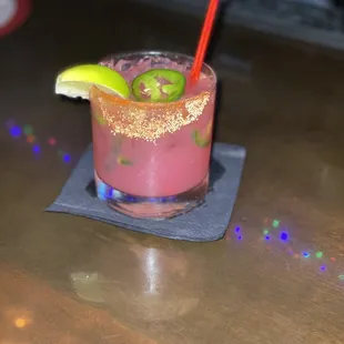 a drink with a lime slice