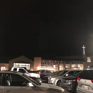 cars parked in a parking lot at night