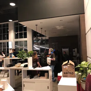 a group of people standing around a counter