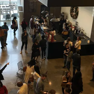 a large group of people standing and sitting