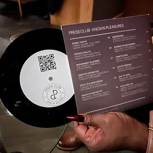 Cocktail menu (track list) and food menu on the QR code on the menu.