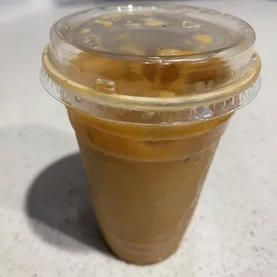 Large 20oz Iced Americano with a splash of half-n-half