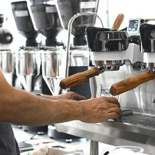 a man making a cup of coffee