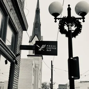 a black and white photo of a street sign