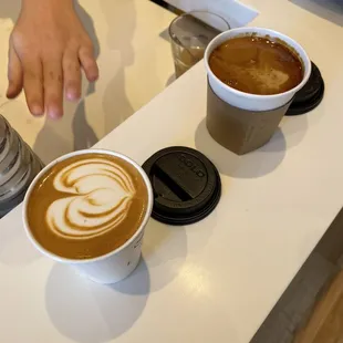 two cups of coffee on a counter