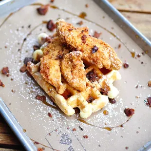 Chicken and Waffles with maple syrup and bacon crumble.